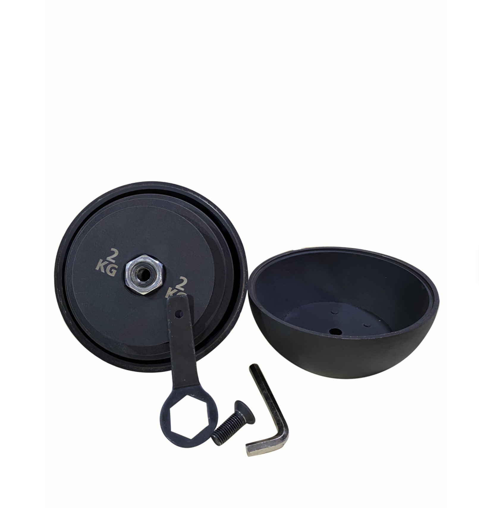 Geöffnete verstellbare Kettlebell mit innenliegenden Gewichtsplatten, Bodenschale und Werkzeug